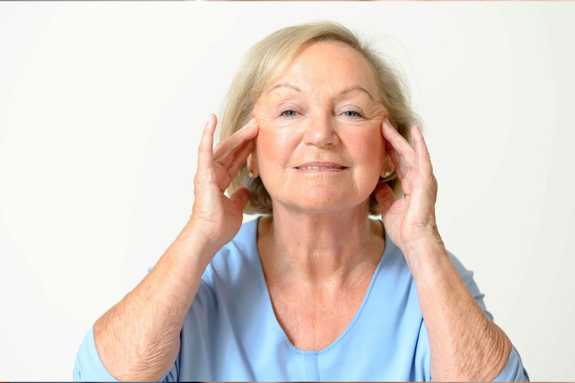 Physician discusses facial treatments with patient in office